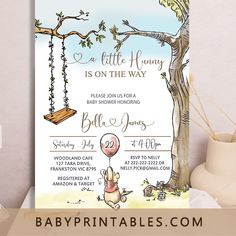 a baby shower is shown with a swing and tree