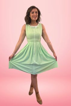 Samantha will add some cheer and positive energy to your wardrobe. Reminiscent of the 1960's color palettes of soft light green with white trim detail on the bow and center front makes this darling dress perfect for casual everyday wear. Features pleated circle skirt with hidden side seam pockets. Don't forget to add a crinoline underneath for that true-to-vintage look! PRODUCT DETAILS: Scoop neckline with bow detail Sleeveless Pleated circle dress Pockets Fabric has no stretch Easy to wear Back Pleated Circle Skirt, Dress Pockets, Circle Dress, Darling Dress, White Trim, Circle Skirt, Trim Detail, Pocket Dress, Casual Everyday