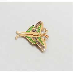 This is part of Chairish’s Costume Jewelry assortment.  Goldtone light and dark green enamel butterfly brooch with security clasp. Marked "Napier." Measures: 2 1/8 inches long by 2 3/4 inches wide. Condition: Very good; perhaps the slightest of surface wear to the goldtone. A blue and green enamel version of this brooch was featured in a c1971 advertisement. I also have a yellow and orange version of this pin as well as one of the other butterflies from the same advertisement.  Please reference Butterfly Brooch, Green Enamel, Modern Branding, Vintage Signs, Costume Jewelry, Light In The Dark, Gold Tones, Green