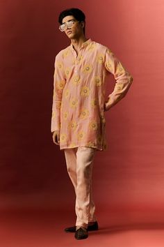 Peach kurta with floral thread hand embroidery. Paired with a matching plain pant. - Aza Fashions Pink Embroidered Festive Pants, Festive Pink Embroidered Pants, Festive Embroidered Pink Pants, Pink Chikankari Embroidery Pants For Eid, Festive Pink Cotton Pants, Spring Orange Kurta With Chikankari Embroidery, Spring Orange Kurta With Floral Embroidery, Eid Orange Kurta With Floral Embroidery, Orange Floral Embroidered Kurta For Eid