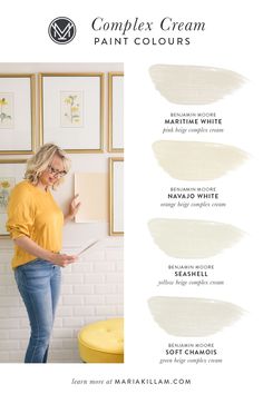 a woman standing in front of a wall with paint colors and the words, complex cream paint colours