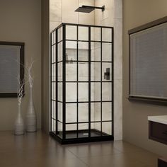 a bathroom with a stand up shower next to a mirror and vase on the floor