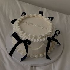 a white cake with black bows on it