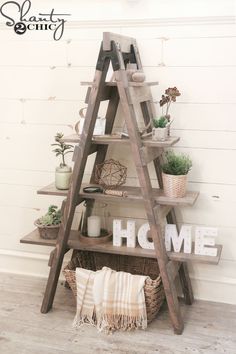 a wooden ladder shelf with some plants on it