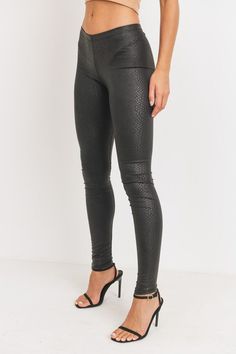 Every fashionista knows she must have a pair of faux snake skin leather leggings in her fall fashion wardrobe. Featuring a high fashion faux leather fabric and body sculpting fit. Make these pants this seasons go-to when dressing them up with your favorite pieces from home! Lightweight Fitted Elastic Waist Fitted Pleather Comfortable Elastic Waist Low Waist Soft Stretchy Material Regular Waist Snake Skin Leggings Embossed Snake Skin PU Leather Leggings 96% Polyester 4% Spandex XOB-PCC-5 Trendy Metallic Leggings For Fall, Chic Metallic Leather Pants For Fall, Metallic Leggings For Night Out In Fall, Chic Fitted Metallic Leather Pants, Snake Skin Pants, Skin Leggings, Cute Slides, Legging Fits, Faux Leather Fabric