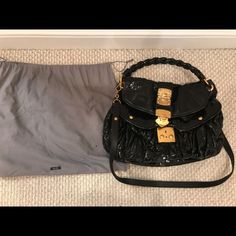 Black Patent Leather Miu Miu Coffer Bag With Gold-Tone Hardware, Removable Long Strap, Braided Top Handle, Push Lock Closure At Front Flap. Includes Dust Bag. Retails $1500. ***Disclaimer: Very Discounted Price Due To Flaking Of Patent Leather. It Is Difficult To Keep Patent Leather For Many Years Without This Happening. It's Such A Great Bag In Perfect Condition Otherwise. I'm Sure It Can Be Fixed But You Can Visibly See Peeing Around Edges*** Miu Miu Formal Bag With Adjustable Strap, Miu Miu Formal Bags With Adjustable Strap, Formal Miu Miu Bags With Adjustable Strap, Black Top Handle Miu Miu Shoulder Bag, Black Miu Miu Top Handle Shoulder Bag, Black Miu Miu Shoulder Bag With Top Handle, Formal Miu Miu Shoulder Bag With Adjustable Strap, Miu Miu Black Shoulder Bag For Everyday Use, Luxury Black Miu Miu Shoulder Bag