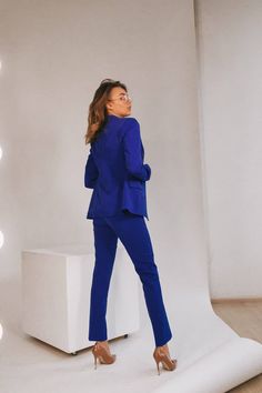 2-piece womens blazer trouser suit for office, business meetings, formal events and special occasions. Also perfectly combines with sneakers so after a long and tiring business day you can change you heels to sneakers and still look chic. DETAILS - slim fit pants - with crease - high rise - blazer is buttoned - lined - front pockets - slim fit MATERIAL Premium quality suiting fabric SIZES The models in photos are wearing a size S Available in 4 sizes: XS= 0-4 US numeric BUST 32-34 inches or 82-8 Fitted Blue Suits For Office Lady, Fitted Blue Office Lady Suits, Blue Suit Collar Blazer For Office, Blue Notch Lapel Suits For Office, Tailored Blue Business Pantsuit, Tailored Blue Pantsuit For Business, Fitted Blue Workwear Sets, Professional Blue Pantsuit For Business, Blue Fitted Workwear Sets