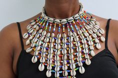 AVANA African Beaded Cowrie Necklace, Gift for her

An authentic cowrie shell necklace that can be worn with any outfit.
100% handmade

Closure: hook

Neck width: 18 inches

3-5 days delivery via DHL Express

The shipping fee is for the first item only and additional items ship for free. Cowrie Shell Art, Traditional Cowrie Shell Beaded Necklaces For Beach, Traditional Handmade Beaded Necklaces For Summer, Bohemian Cowrie Shell Beaded Necklace For Festival, Handmade Cowrie Shell Beaded Necklaces For Festivals, Handmade Shell-shaped Beaded Necklace For Festival, Bohemian Cowrie Shell Beaded Necklaces, Bohemian Cowrie Shell Beaded Necklace, Traditional Handmade Beaded Cowrie Shell Necklace