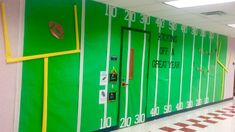 an empty hallway with green and yellow painted walls