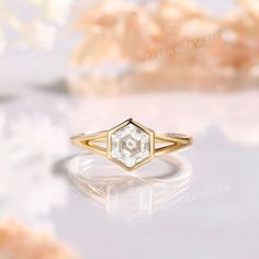 a diamond ring sitting on top of a table