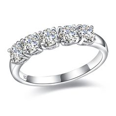 a white gold ring with five diamonds on the top and side stones in the middle