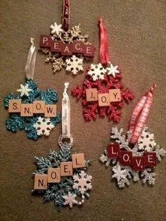 christmas ornaments made from scrabbles on the floor with words that spell out peace and joy