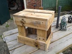 a wooden box sitting on top of a wooden table