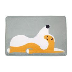 a yellow and white rug with a dog laying on it's back in front of a gray background