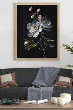 a living room scene with focus on the sofa and flowers