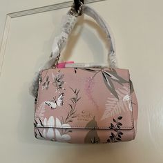 This Beautiful Nwt Kate Spade Mini Emelyn Briar Lane Botanical Pink Multi Crossbody Bag Also Has Two Handles, And Makes The Perfect Gift! It Features A Pale Pink Background With A Butterfly On The Front, And Flowers And Leaves In Shades Of Taupe, Pink, White And Black. The Material Is Pebbled Leather, With A Two Way Spade Jacquard Lining. There Is A Metal Pinmount Logo. The Style Is A Crossbody With Snap Closure And Shoulder Chain. It Also Features A Short Chain Handle As Well As A Leather Strap Kate Spade Top Handle Bag For Spring, Kate Spade Spring Satchel Shoulder Bag, Kate Spade Satchel Shoulder Bag For Spring, Kate Spade Spring Satchel Bag, Kate Spade Satchel Bag For Spring, Kate Spade Satchel For Spring, Kate Spade Luxury Bags For Spring, Luxury Kate Spade Bags For Spring, Spring Luxury Kate Spade Bags