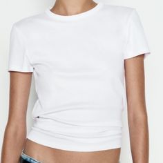 Zara Short Sleeve Rib Top Tee Shirt White Slim Fit - Round Neck - Regular Length - Short Sleeve T-Shirt Made Of A Cotton Blend. Round Neck And Short Sleeves. White | 4174/168 Classic Stretch Top With Short Sleeves, Basic Shirttail Hem Tops, Basic Fitted Short Sleeve Tops, Fitted Short Sleeve Basic Tops, Basic Stretch Tops With Shirttail Hem, Simple Everyday Fitted Top, Simple Fitted Everyday Top, Classic Fitted Crew Neck Shirt, Classic Crew Neck Stretch Tops