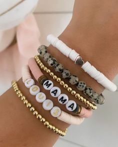 "Brand new to the Louis and Finn, our heishi beads have quickly become an arm party must have! So cute! So fun! Personalize with your wording and pick your favorite color from the drop down menu. Pick from our beautiful pale peachy pink heishi, leopard stones, dainty 4 mm gold beads, white heishi and brand new to the shop -- mauve heishi! We have now added the option to shop this EXACT look! If you select \"set of 6 bracelets\" from the dropdown menus, the bracelets will come as displayed (2 gol Trendy Heart Beads Bracelets For Mother's Day, Trendy Heart Beads Bracelet For Mother's Day, Cute Everyday Beaded Bracelets, Trendy Beaded Bracelets For Mother's Day, Adjustable Beaded Bracelets With Heart Beads For Birthday, Adjustable Heart Beaded Bracelets For Birthday, Beaded Bracelets With Heart Beads For Birthday, Casual Everyday Friendship Bracelets With Spacer Beads, Heart Beaded Bracelets For Birthdays