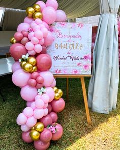 pink and gold balloon arch for a baby shower