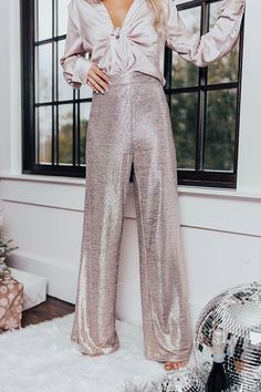 Arrive to any holiday occasion looking fabulous in our fun natural hued 'More Champagne Flares' featuring lightweight material with metallic detailing, an high elastic waistline, and a relaxed but flattering silhouette that falls into flared ankle-length hemlines! Measurements XS : Hip 34", Inseam 30.5", Length 41.5", Waist 26". S : Hip 36", Inseam 31", Length 41.5", Waist 28". M : Hip 38", Inseam 31.5", Length 42.5", Waist 30". L : Hip 40", Inseam 32", Length 43.5", Waist 32". 2023 Holiday Outfits, Las Vegas Outfit, Glamorous Outfits, Holiday Clothes, Vegas Outfit, Metallic Pants, Nye Outfits, Online Closet, Style 2023