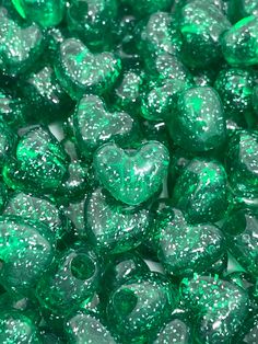 green heart shaped candies with glitter on them