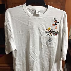 Warner Bros. Studio Store Authentic Wb Tshirt With Embroidered Bugs Bunny, Tweety, Sylvester, Daffy Duck, Marvin The Martian And Taz. Nwt From A Smoke Free And Pet Free Home. White Crew Neck Top With Embroidered Graphics, White Embroidered Crew Neck Top, White Embroidered Graphic Tee, Casual White Embroidered Shirt, White Embroidered Casual Shirt, White Cotton T-shirt With Embroidered Graphics, White Relaxed Fit T-shirt With Embroidered Graphics, White Relaxed Fit Top With Embroidered Logo, White Casual Shirt With Embroidered Graphics