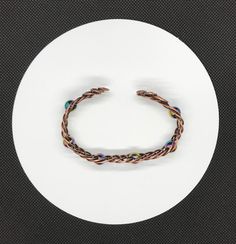 a white plate with a bracelet on it