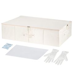 an open suitcase with white gloves and cleaning cloths next to it on a white background