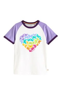 Butterflies in rainbow hues flutter in heart formation on this raglan-sleeve colorblock T-shirt made from soft cotton. 100% cotton Machine wash, tumble dry Imported Playful Multicolor Color Block T-shirt, Rainbow Color Block Cotton Tops, Playful Cotton T-shirt With Heart Graphic, Playful Color Block Crew Neck T-shirt, Playful Short Sleeve Rainbow Print Tops, Playful Short Sleeve Tops With Rainbow Print, Playful Color Block Cotton Tops, Playful White Top With Rainbow Print, Playful Cotton Tops With Heart Print