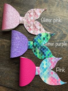 three different types of hair bows on top of a wooden table with text that says glitter pink, glitter purple, and pink