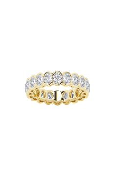 a yellow gold wedding band with white diamonds