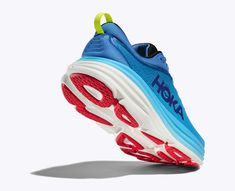 a blue and red shoe with the word hoka written on it's side