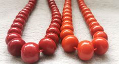 material:natural stone with heat treated coral color quantity:one strand 22inch=57-60pcs size:approx.7X10-17X22mm note:have larger stock and offert wholesale price. Orange Red Coral Necklace With Round Beads, Red Wooden Beads Round Necklace, Red Necklace With Wooden Beads, Orange Red Coral Beaded Necklaces, Orange Red Coral Necklace With Colorful Beads, Orange Necklace With Colorful Beads And Red Coral, Red Coral Necklace With Wooden Beads, Handmade Orange Red Coral Necklace, Large Necklace