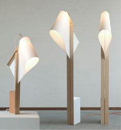 three lamps with different shapes and sizes on them