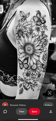 black and white photo of a woman's arm with sunflowers on it