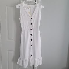 Monteau Button Down Sleeveless Dress. Upper Part Of Dress Is Buttons Opening Closure And Waist Down Buttons Are Sewn On Doesn't Open And Ruffled At The Bottom. This Dress Is Simple But Yet Chic. 70% Rayon And 30% Linen. Size S White Sleeveless Sundress With Button Closure, White Sleeveless Midi Dress With Button Closure, Knee-length Button Sundress For Day Out, Sleeveless Cotton Midi Dress With Buttons, Sleeveless Dress With Buttons For Vacation, Knee-length Sundress With Button Closure For Day Out, Sleeveless Button Closure Midi Dress For Beach, Knee-length Buttoned Sundress For Vacation, Fitted Sleeveless Sundress With Button Closure