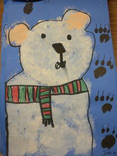 a drawing of a polar bear wearing a scarf and paw prints on it's chest