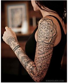 a woman with a tattoo on her arm