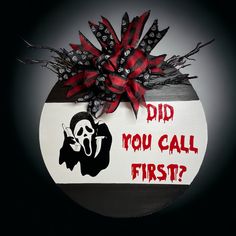 a sign that says did you call first? with a skull on it and a bow