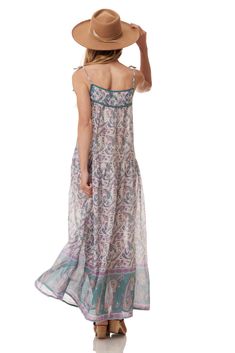 The Betsy long dress is perfect for summer. This dress is designed to be light and flowy. With a beautiful print, this dress is THE must-have item in your wardrobe this season.Color: Teal Size One Size, Fits Size 2 to 10 100% Indian Cotton Made in India Patterned Printed Maxi Dress For Beach, Floral Print Boho Dress For Summer Festival, Summer Boho Dress With Floral Print For Festival, Printed Flowy Maxi Dress, Bohemian Maxi Dress For Summer Garden Party, Summer Festival Boho Dress With Floral Print, Breezy Printed Maxi Dress For Vacation, Spring Boho Maxi Dress With Paisley Print, Bohemian Boho Print Maxi Dress For Garden Party