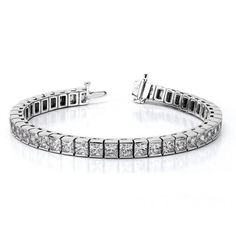 a diamond tennis bracelet on a white background