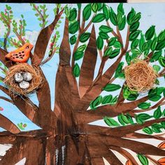 an art project with birds and nests in a tree