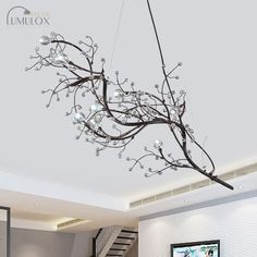 The Situla Metallic Thin Branch Chandelier with Crystal Bead is the epitome of elegance and romance. With its delicate metal branches in a metallic finish, this chandelier adds a touch of glamour to any space. The 10 lights illuminate your boutique with a warm and inviting glow, creating an enchanting ambiance. The crystal bead accents add a luxurious touch, reflecting the light and creating a mesmerizing effect. This suspension light is perfect for boutiques, adding a captivating focal point to your store. Whether you are looking to create a romantic atmosphere or simply want to elevate the style of your boutique, the Situla Metallic Thin Branch Chandelier is the perfect choice.Size: 25 Inch Above Fixture Width: 39" Bulb Included: No Canopy Shape: Round Number of Tiers: 1 Tier Material: M Pendant Light Set, Branch Chandelier, Pendant Light Styles, Beaded Chandelier, Luminous Colours, Suspension Light, Black Chandelier, Romantic Art, Metal Style