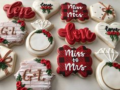 decorated cookies arranged in the shape of heart, love, mrs to mrs and more