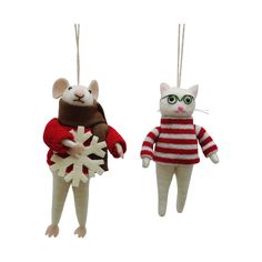 two ornaments are hanging from strings with mice wearing sweaters and glasses, one is holding a snowflake