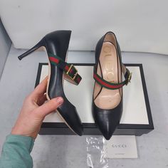 Gucci Black Leather Sylvie Mary Jane Web Pump Size Eu 38 Us 8 Womens Comes With Box 100% Authentic All Black Heel With Signature Gucci Web Across The Upper With A Gold Buckle Slim Heel Red Green Web Heels: 3" Please Note Signs Of Wear On Bottom As Shown. Please Note Any Scratches/Lines Have Been Polished Over As Shown. Please Note Signs Of Wear On Heel As Shown Gucci Black Heels With Buckle Closure, Gucci Ankle Strap Heels In Calf Leather, Gucci Ankle Strap Leather Heels, Gucci Leather Heels For Business, Designer Ankle Strap Heels For Business, Gucci Round Toe Heels With Buckle Closure, Gucci Heels With Buckle Closure And Round Toe, Gucci Business Heels With Branded Heel Counter, Gucci Ankle Strap Heels For Office