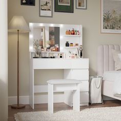 a bedroom with a vanity, stool and mirror