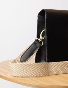 Looking to accessorize your O My Bag? Our sand coloured herringbone webbing strap is the perfect add-on for those who like a neutral color palette. This updated design measures 4cm in width, which is slightly thinner compared to our original webbing straps. All O My Bags with a detachable strap design can be styled with the sand webbing strap. OMB-sandblackstrap Rectangular Leather Strap Shoulder Bag For Work, Rectangular Shoulder Bag With Leather Strap For Work, Rectangular Beige Bag With Leather Strap, Beige Rectangular Bag With Leather Strap, Adjustable Bags With Leather Trim For Everyday Use, Everyday Bags With Adjustable Leather Trim, Everyday Use Bags With Leather Trim And Adjustable Fit, Adjustable Black Bag With Leather Strap, Classic Everyday Bag With Strap