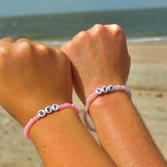 Matching bff bracelets for you and your best friend!! Cheap White Bracelets For Best Friend, Casual Beaded Jewelry For Best Friend Gift, Adjustable Pink Friendship Bracelets, Trendy Purple Friendship Bracelets As Gift, Pink Bracelet Wristband For Birthday, Pink Beaded Jewelry For Best Friend Gift, Personalized Purple Wristband For Friendship, Pink Wristband For Birthday, Purple Friendship Bracelets With Letter Beads