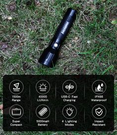 the flashlight is laying on the grass with its light on and instructions to use it